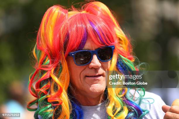 Dan Downey watches the beginning of the parade on Boylston Street during the annual Boston Pride Parade, which took place through the streets of the...