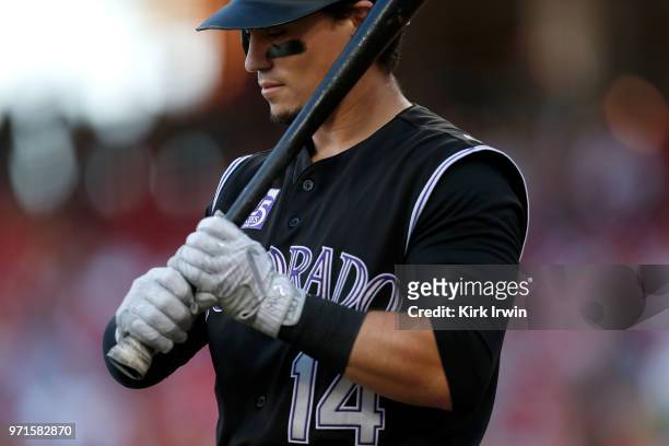 Tony Wolters of the Colorado Rockies prepares to take an at bat during the game against the Cincinnati Reds at Great American Ball Park on June 6,...