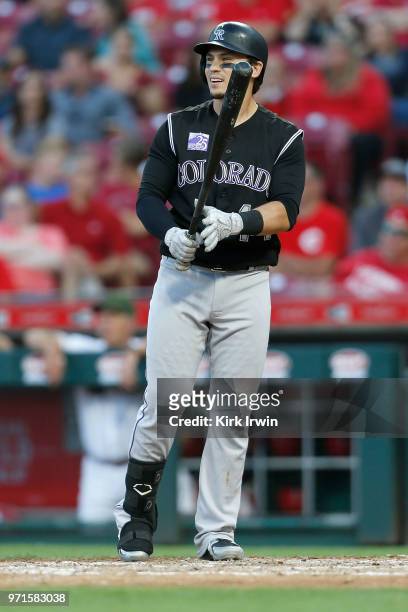 Tony Wolters of the Colorado Rockies takes an at bat during the game against the Cincinnati Reds at Great American Ball Park on June 6, 2018 in...
