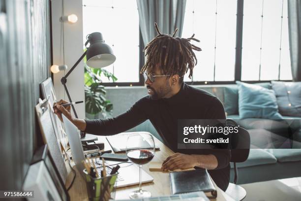 artist caught in moment - black artist stock pictures, royalty-free photos & images