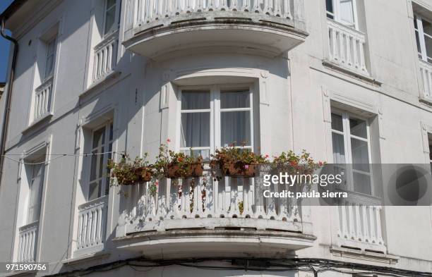 balcony with flower pots - mondonedo stock pictures, royalty-free photos & images