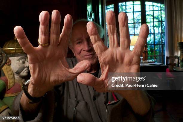 The hands of legendary 94 year-old American photojournalist David Douglas Duncan , better known as DDD, at a restaurant with friends in La Garde...