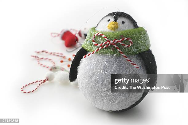Washington Post Studio DATE: December 12, 2008 PHOTO: Julia Ewan/TWP Shopper - Trim Holiday - Penguin crepe ornament holder from Hidden Treasures,...