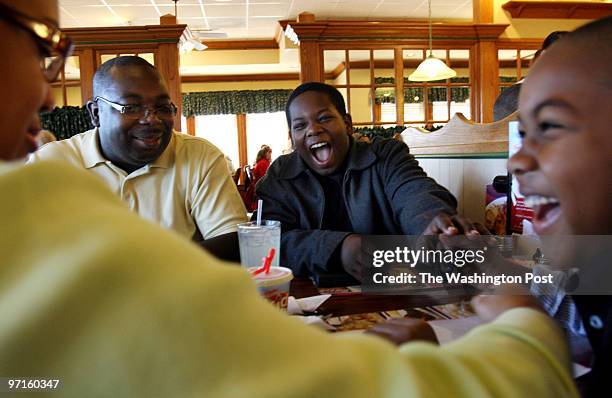 Woodbridge,VA Greta and Harrison Duncan and their two boys Isaiah and Ephraim enjoy their regular Sunday morning breakfast together at Bob Evans...