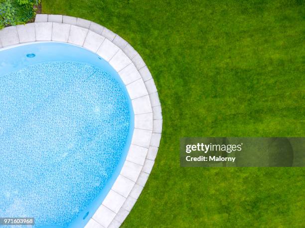 swimming pool. directly above aerial view, drone perspective. - aerial pool stock-fotos und bilder