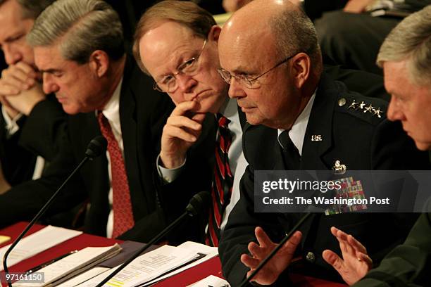 From left, Assistant Secretary of State for Intelligence and Research, Randall Fort; FBI Director Robert Mueller; Director of National Intelligence...