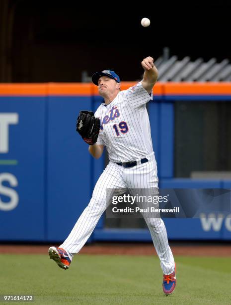 Jay Bruce of the New York Mets makes a running throw after catching the ball in the outfield in an interleague MLB baseball game against the...