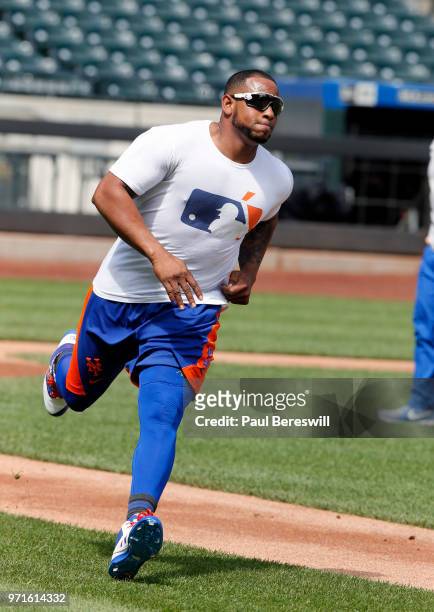Yoenis Cespedes of the New York Mets, recovering from injury, warms up before an interleague MLB baseball game against the Baltimore Orioles on June...