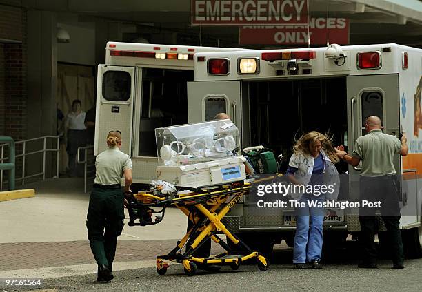 Baby is brought by ambulance TO Tulane University Hospital in New Orleans, La., as preparations are made for Hurricane Gustav's arrival on Sunday,...