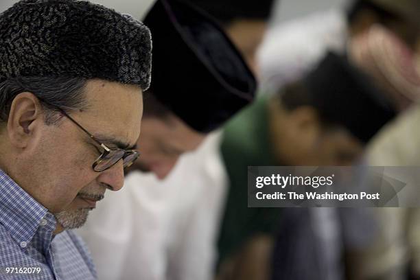 Dominic Bracco II TWP Dr. Ahsanullah Zafar prays in the basement of the national headquarters of the Ahmadiyya sect of Islam in Silver Spring, MD on...