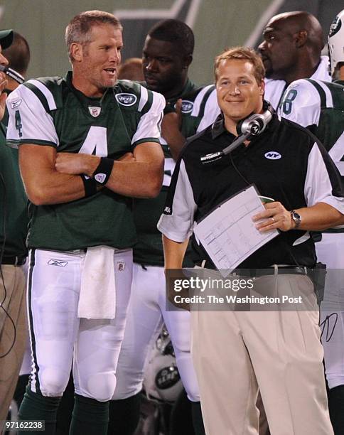 East Rutherford, NJ. Redskins at Jets. Here, Brett Favre talks with Jets Head Coach Eric Mangini during fourth quarter action.