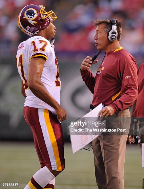 East Rutherford, NJ. Redskins at Jets. Here, Jim Zorn talks to Jason Campbell during a break in action in the first quarter.