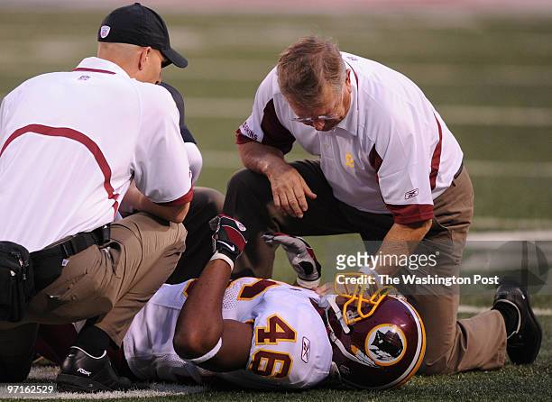 East Rutherford, NJ. Redskins at Jets. Here, Redskins trainers tend to Ladell Betts after he injured himself in the first quarter.