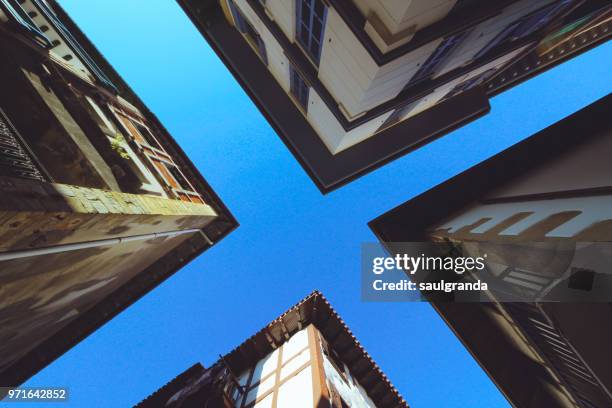 low angle view of four buildings from a crossroad - hondarribia bildbanksfoton och bilder