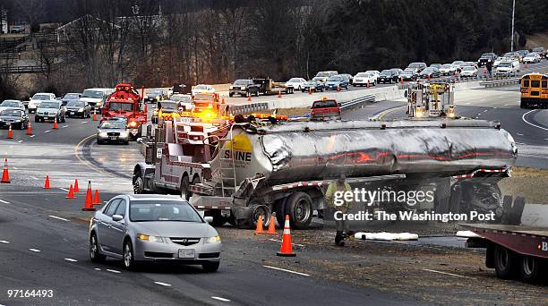 Ph-crash27 assignment #: 206127 Dulles Greenway a fuel tanker crashes stopping am rush hour traffic Photographer: Gerald Martineau A tanker lies off...