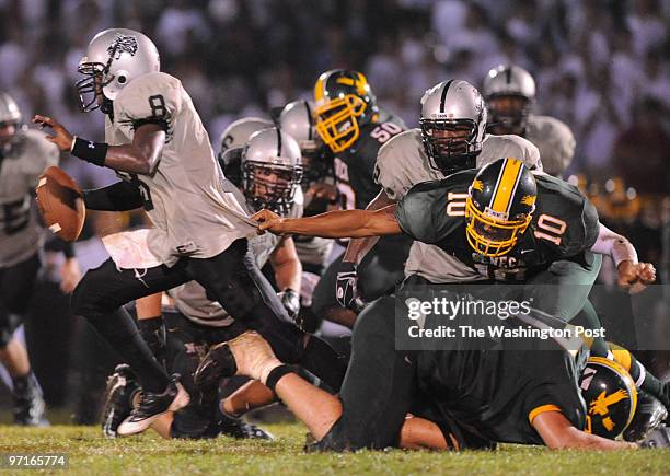 September 12, 2008 CREDIT: Toni L. Sandys_TWP Germantown, MD Northwest quarterback Jarrhett Butler tries to scramble out of the pocket as Seneca...
