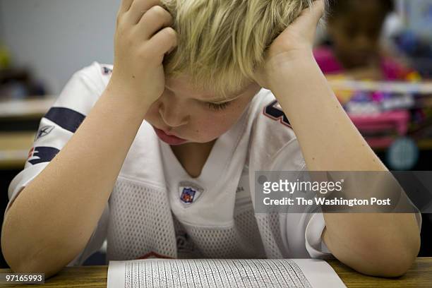 Fifth grader, Garrett Darling works on a word search on his first day back to school at Swans Creek Elementary School in Dumfries, Va on September 2,...