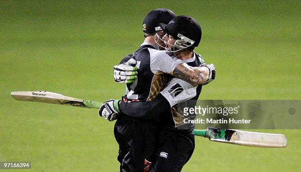 Brendon McCullum and Martin Guptill of New Zealand celebrate victory after the Twenty20 International match between the New Zealand Black Caps and...