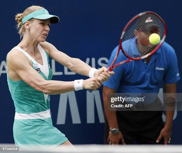 Russian tennis player Elena Dementieva plays a return to her compatriot opponent Alisa Kleybanova during their final match of the WTA Tour Malaysian...