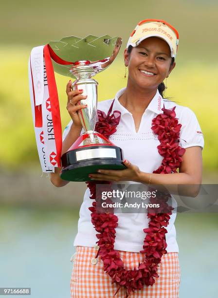 Ai Miyazato of Japan holds the winner's trophy after winning the HSBC Women's Champions at Tanah Merah Country Club on February 28, 2010 in...