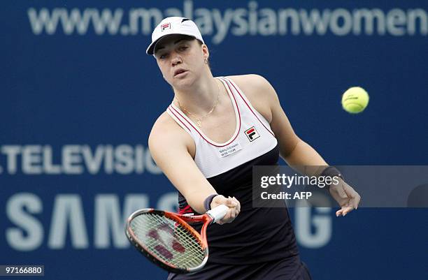 Russian tennis player Alisa Kleybanova hits a return to compatriot opponent Elena Dementieva during their final match of the WTA Tour Malaysian Open...