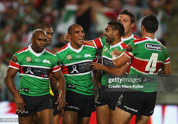 Fetuli Talanoa of the Rabbitohs is congratulated by his team after scoring a try during the NRL Charity Shield match between the South Sydney...