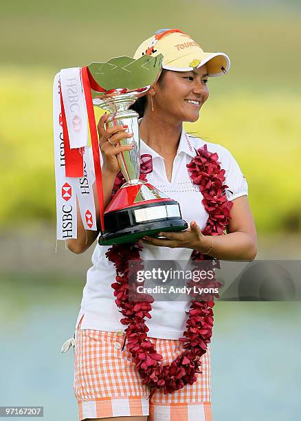 Ai Miyazato of Japan holds the winner's trophy after winning the HSBC Women's Champions at Tanah Merah Country Club on February 28, 2010 in...
