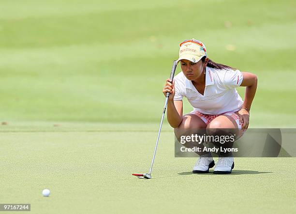 Ai Miyazato of Japan lines up her birdie putt on the 16th hole during the final round of the HSBC Women's Champions at Tanah Merah Country Club on...