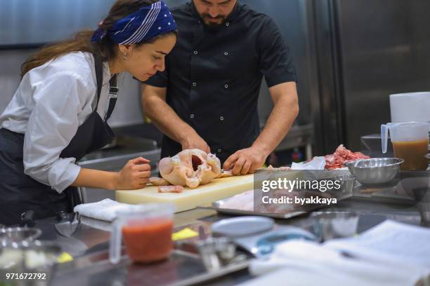 chef preparing chicken meat - bird chefs hat stock pictures, royalty-free photos & images