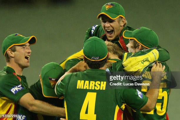 Tigers players celebrate a wicket during the Ford Ranger Cup Final match between the Victorian Bushrangers and the Tasmanian Tigers at the Melbourne...