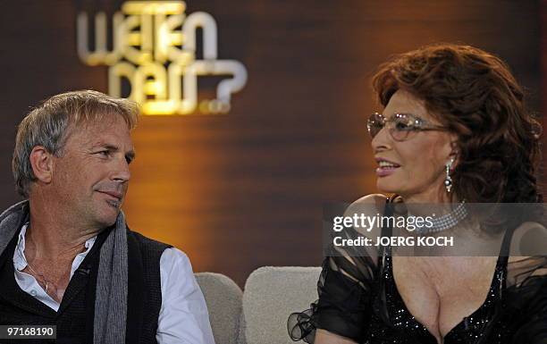 Italian actress Sophia Loren talks to US actor and singer Kevin Costner during the 187th edition of the TV show "Wetten, dass..?" on February 28,...