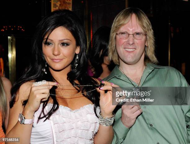 Television personality Jenni "JWoWW" Farley from the MTV show, "Jersey Shore" and her father Terry Farley appear after being presented with Playboy...