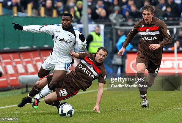 Matthias Lehmann of St. Pauli and Christopher Katongo of Bielefeld battle for the ball during the Second Bundesliga match between FC St. Pauli and...
