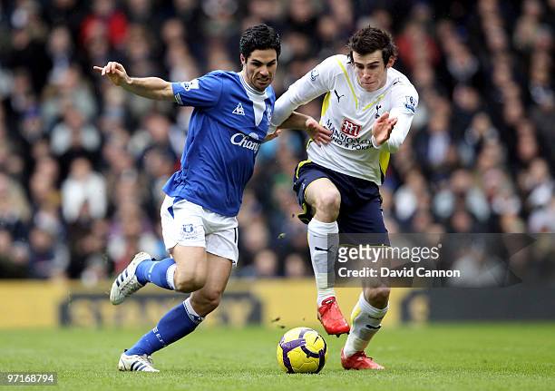 Gareth Bale of Tottenham and Mikel Arteta of Everton battle for the ball during the Barclays Premier League match between Tottenham Hotspur and...