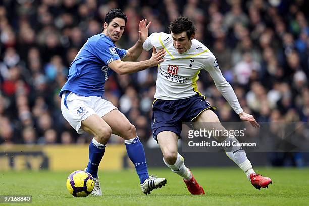 Gareth Bale of Tottenham and Mikel Arteta of Everton battle for the ball during the Barclays Premier League match between Tottenham Hotspur and...