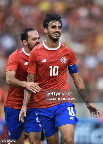 Costa Rica's forward Bryan Ruiz celebrates with Costa Rica's forward Marco Urena after scoring a goal during the international friendly football...