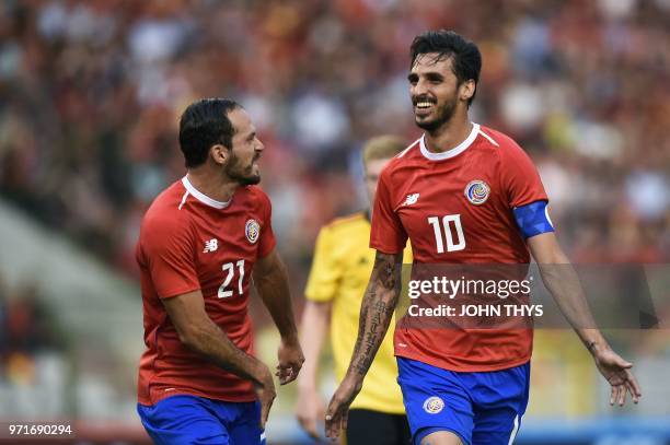 Costa Rica's forward Bryan Ruiz celebrates with Costa Rica's forward Marco Urena after scoring a goal during the international friendly football...