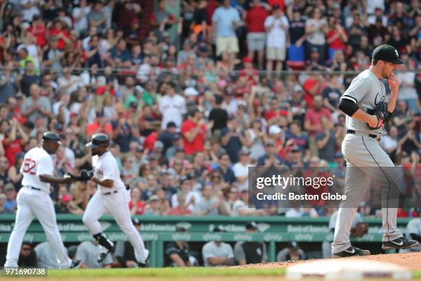 Boston Red Sox player Jackie Bradley Jr. Rounds third base after hitting a solo home run off of Chicago White Sox starting pitcher Carlos Rodon...