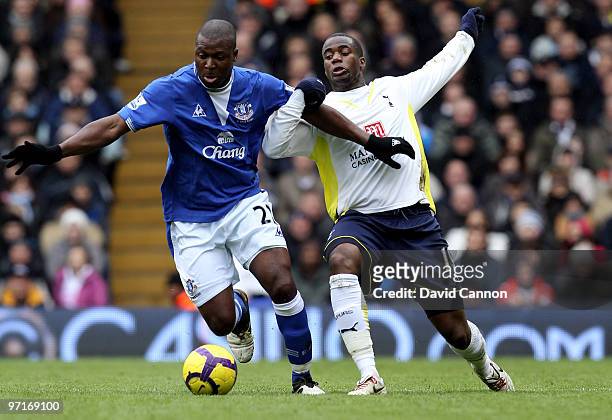 Sebastien Bassong of Tottenham battles for the ball with Ayegbeni Yakubu of Everton during the Barclays Premier League match between Tottenham...