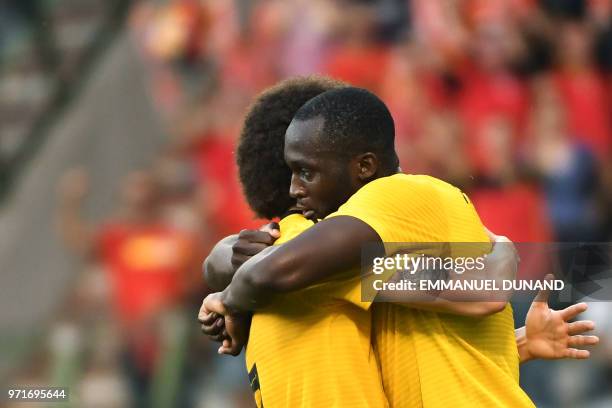 Belgium's forward Romelu Lukaku celebrates with a teammate after scoring a goal during the international friendly football match between Belgium and...