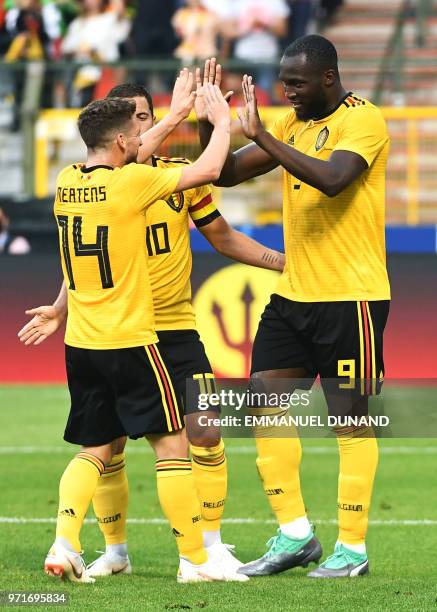 Belgium's forward Romelu Lukaku celebrates with a teammates Belgium's forward Dries Mertens and Belgium's forward Eden Hazard after scoring a goal...