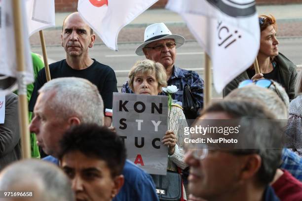 People holding flag of Poland and European Union are seen in Gdansk, Poland on 11 June 2018 People gather outside the courts around the country to...