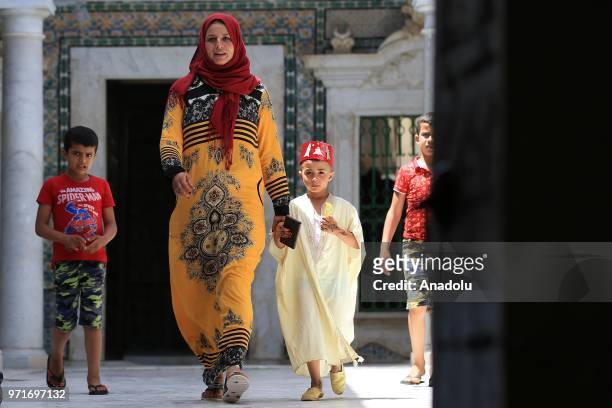 Tunisian families bring their children for annual circumcision feast tradition at Sidi Sahab Zawiya and Madrasa ahead of Laylat al-Qadr in Kairouan,...