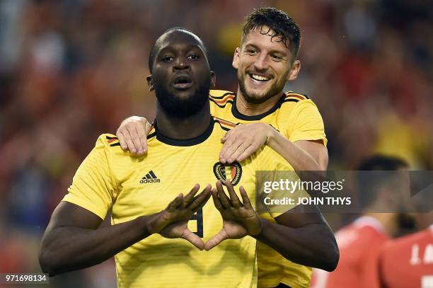 Belgium's forward Romelu Lukaku celebrates with teammate Belgium's forward Dries Mertens after scoring a goal during the international friendly...