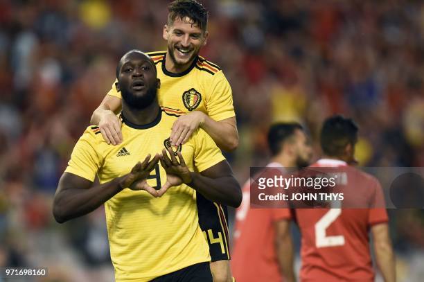 Belgium's forward Romelu Lukaku celebrates with teammate Belgium's forward Dries Mertens after scoring a goal during the international friendly...