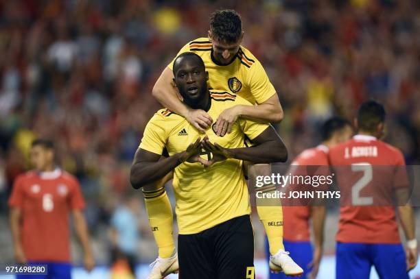 Belgium's forward Romelu Lukaku celebrates with teammate Belgium's forward Dries Mertens after scoring a goal during the international friendly...