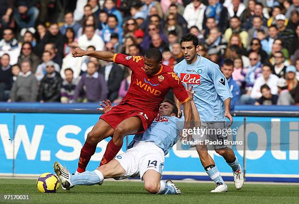 Julio Baptista of AS Roma and Hugo Armando Campagnano of SSC Napoli compete for the ball as Michele Pazienza of SSC Napoli looks onduring the Serie A...