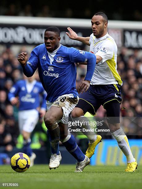Younes Kaboul of Tottenham chases Victor Anichebe of Everton during the Barclays Premier League match between Tottenham Hotspur and Everton at White...