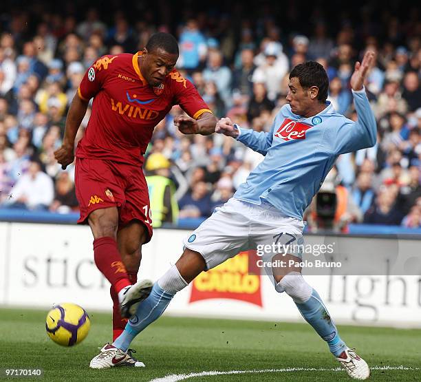 Julio Baptista of AS Roma and Leandro Rinaudo of SSC Napoli compete for the ball during the Serie A match between Napoli and Roma at Stadio San Paolo...