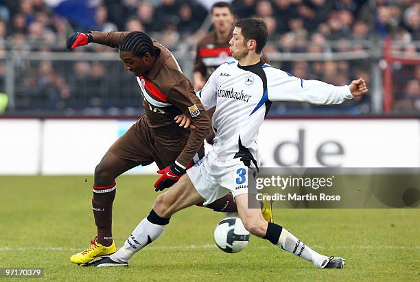 Richard Sukuta Pasu of St. Pauli and Markus Bollmann of Bielefeld battle for the ball during the Second Bundesliga match between FC St. Pauli and...